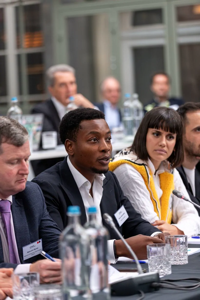 Samy speaking at a roundtable forum